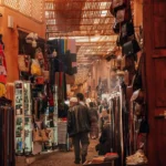 Marrakech Medina at night with illuminated alleys and local life