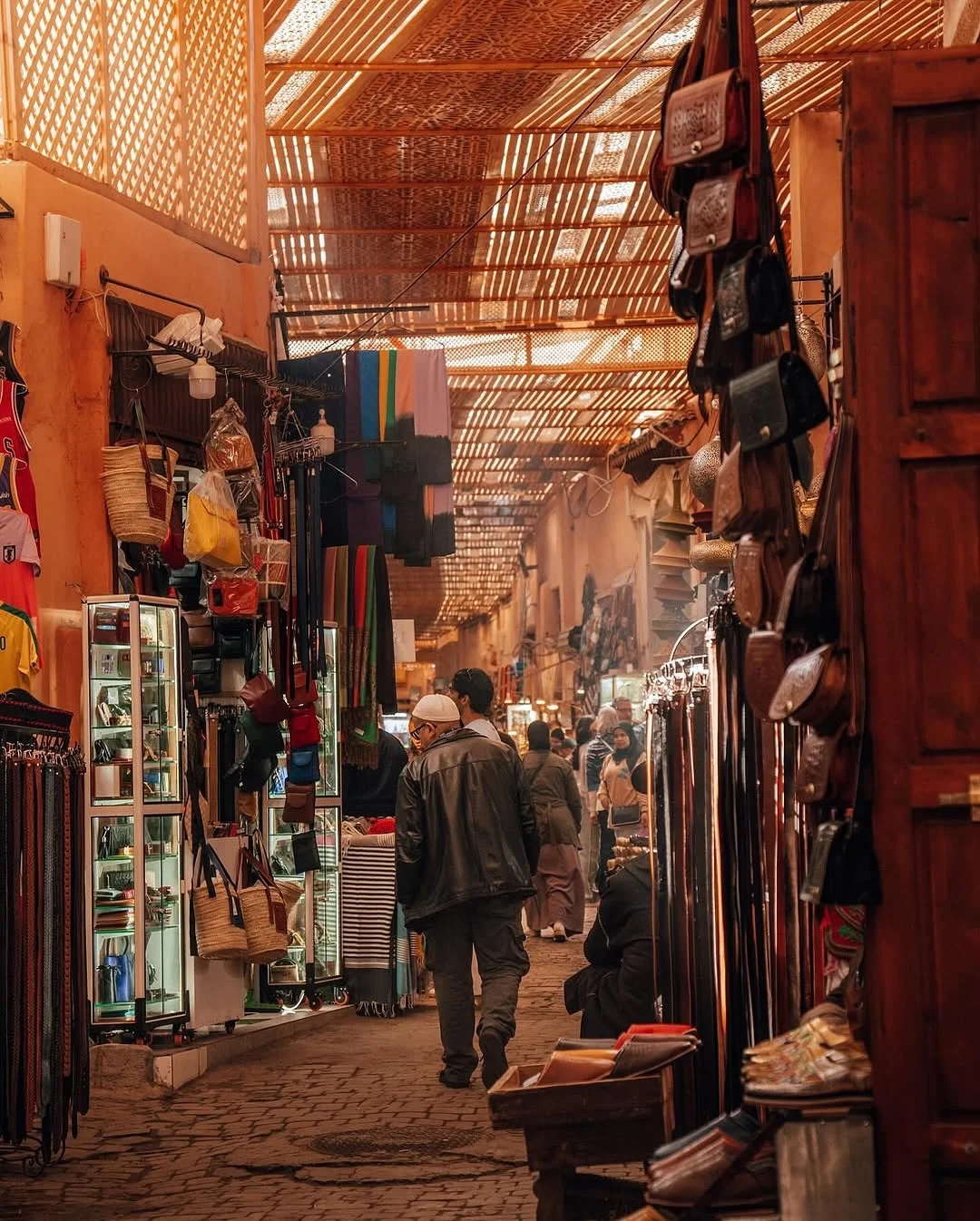 Marrakech Medina at night with illuminated alleys and local life