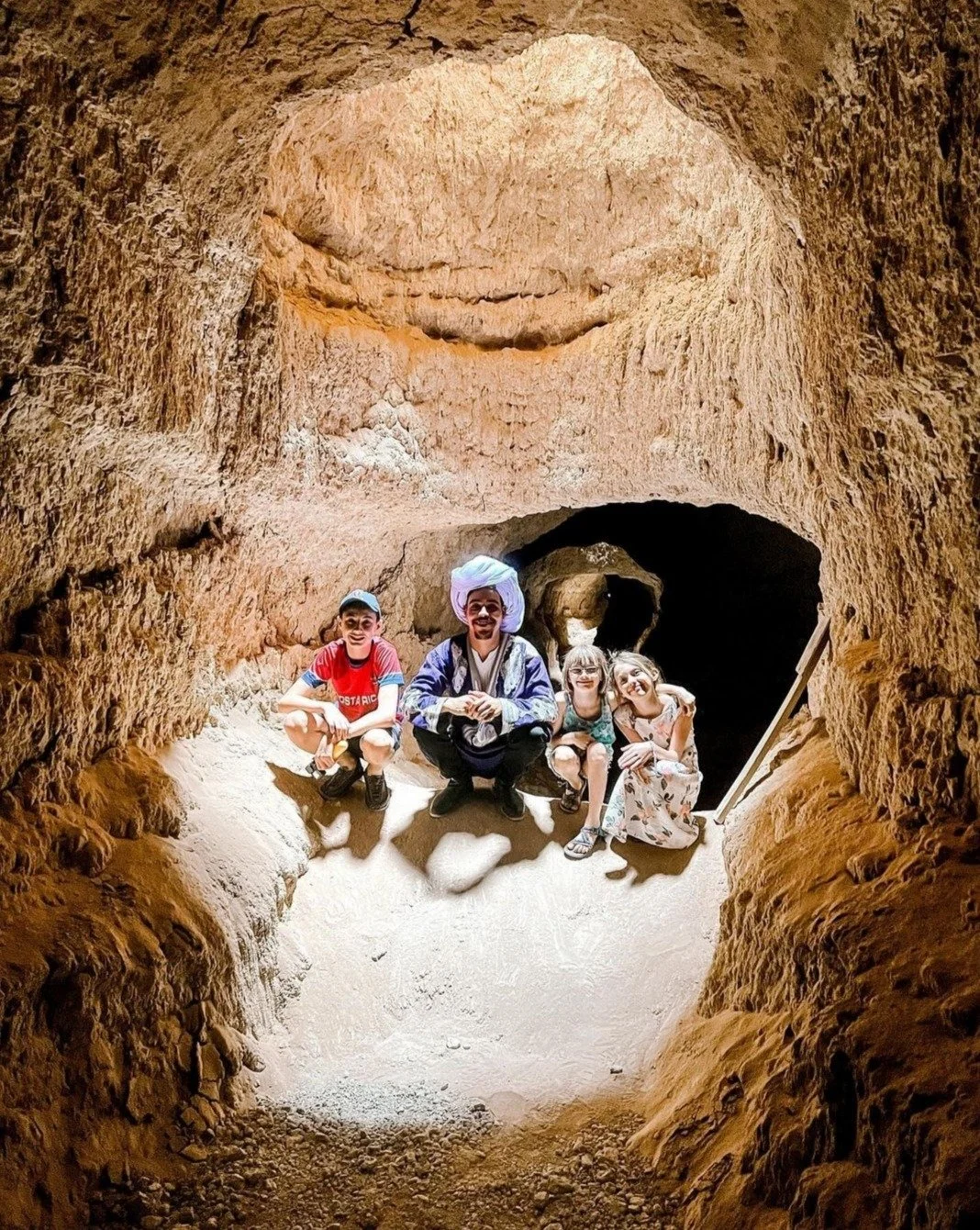 Morocco family tours enjoying a camel ride in the Sahara Desert with children and parents