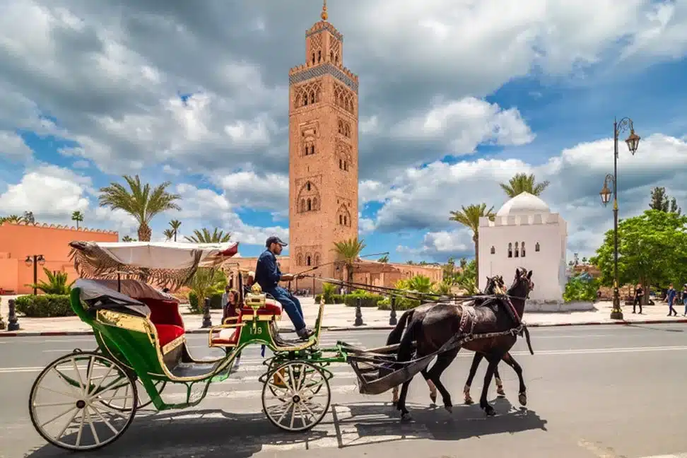 American travelers enjoying a private Morocco tour in the Sahara Desert with camel trekking and luxury camp experience