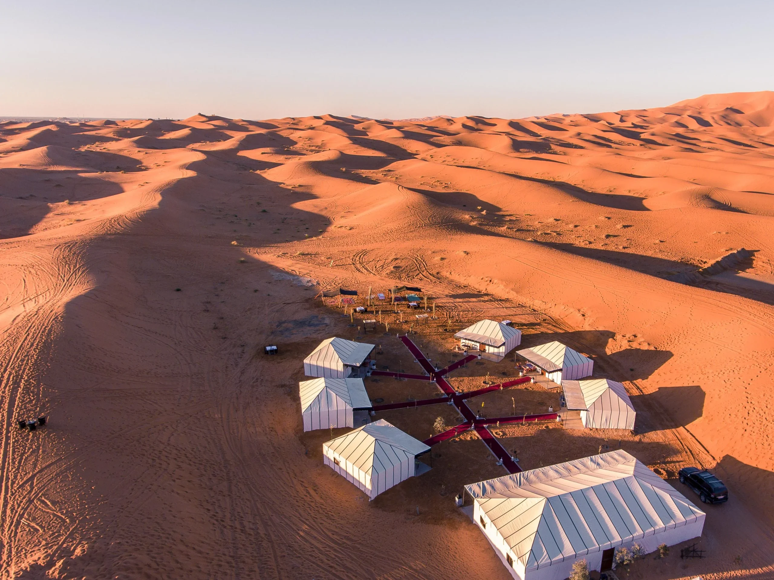 Camel trekking through the Erg Chebbi dunes in the Sahara Desert, Morocco.