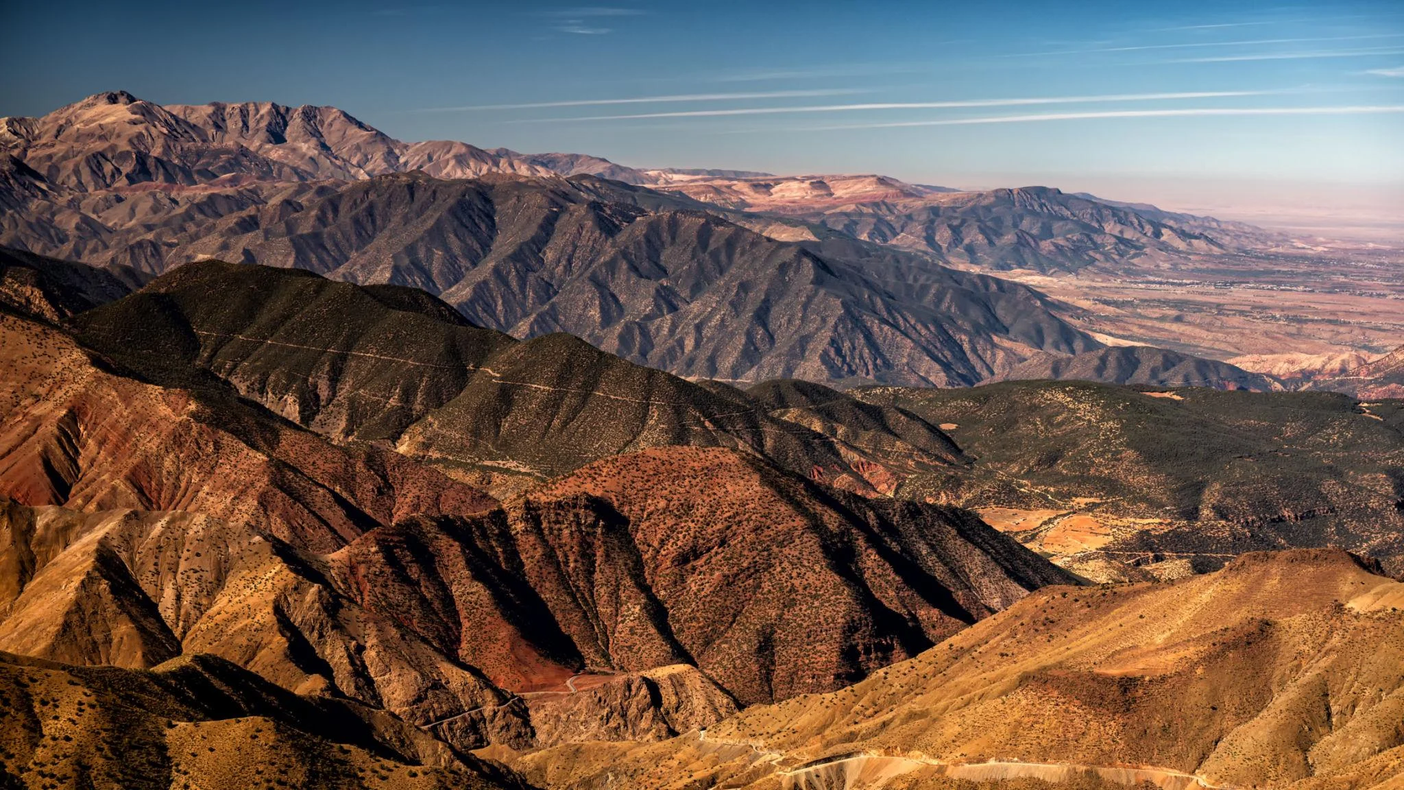 Panoramic view of the High Atlas Mountains in Morocco with traditional Berber villages.