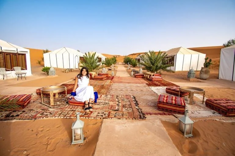 women-sahara-desert-tour-morocco Women enjoying a camel ride in the Sahara Desert during a private Morocco tour.